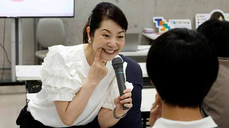 Japanese attend smiling lessons after getting used to masks during Covid